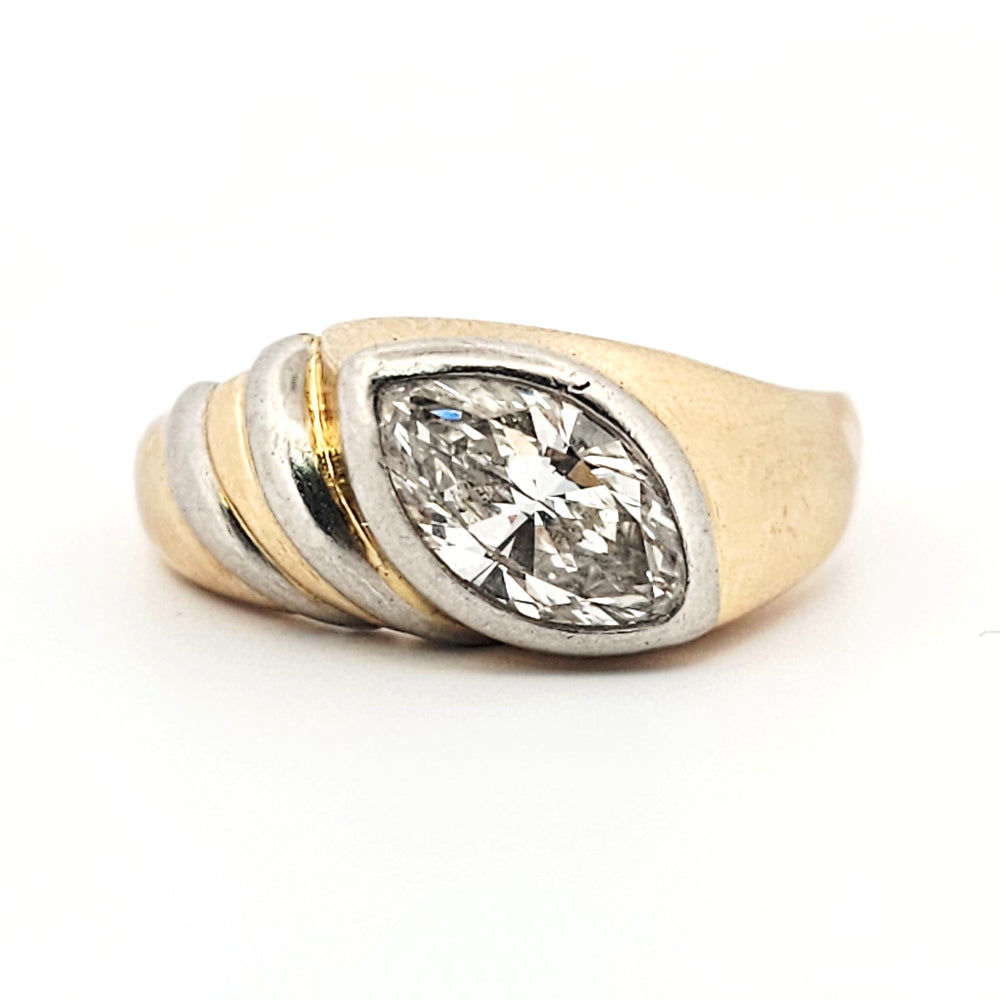 A marquise brilliant cut diamond modern solitaire ring