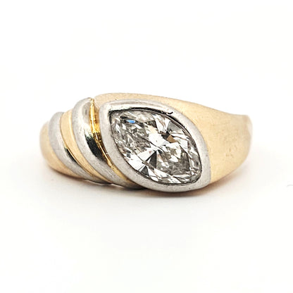 A marquise brilliant cut diamond modern solitaire ring