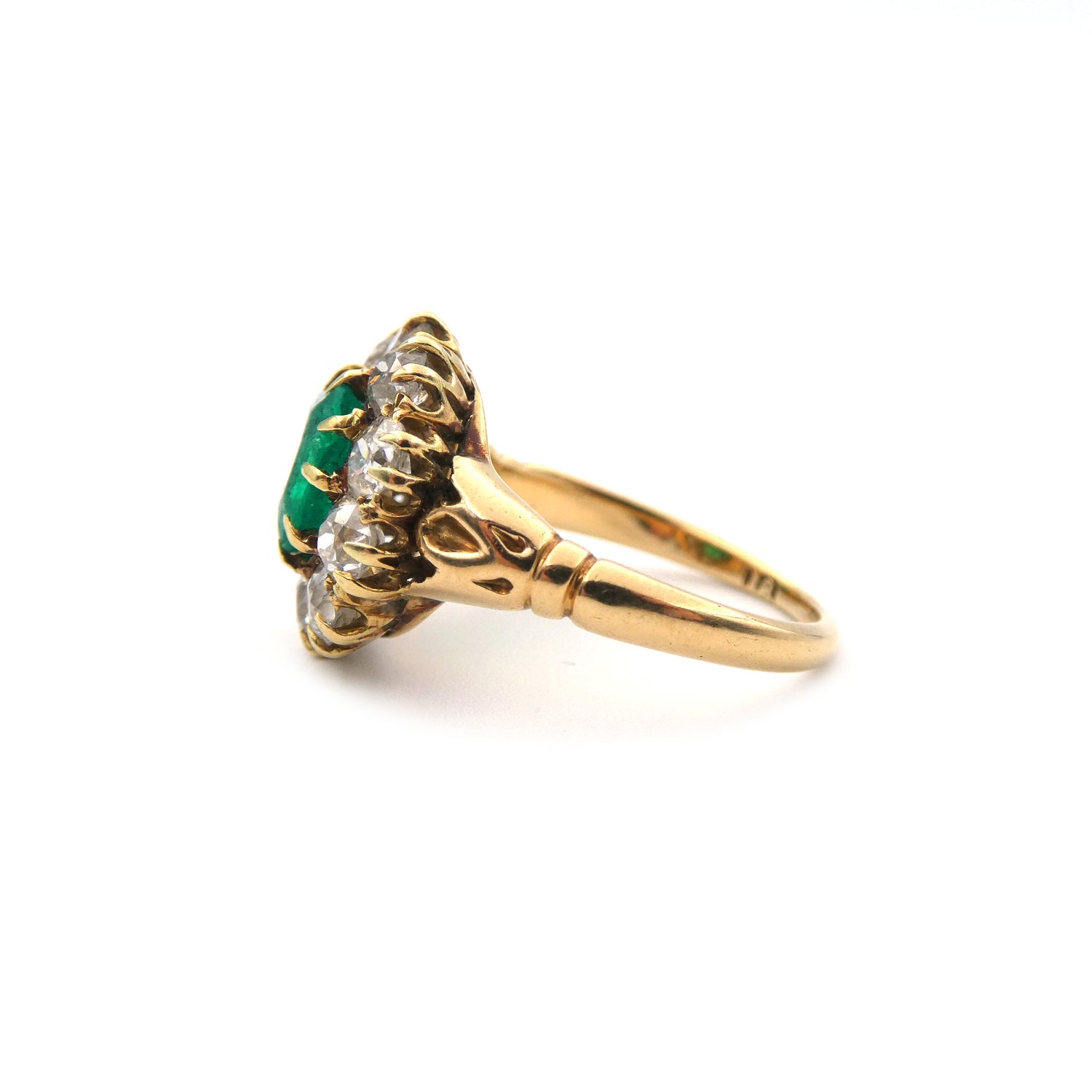 An Emerald and diamond cluster ring