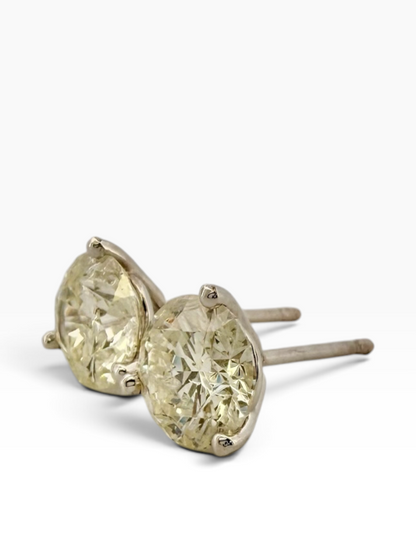 Pair of solitaire diamond earrings