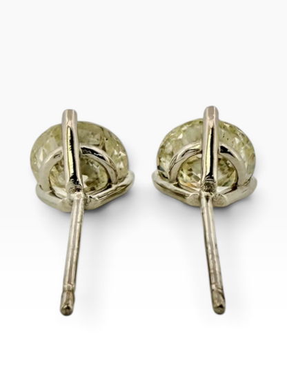 Pair of solitaire diamond earrings