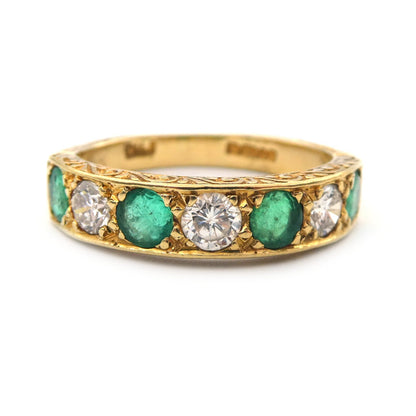An Emerald and diamond dress ring