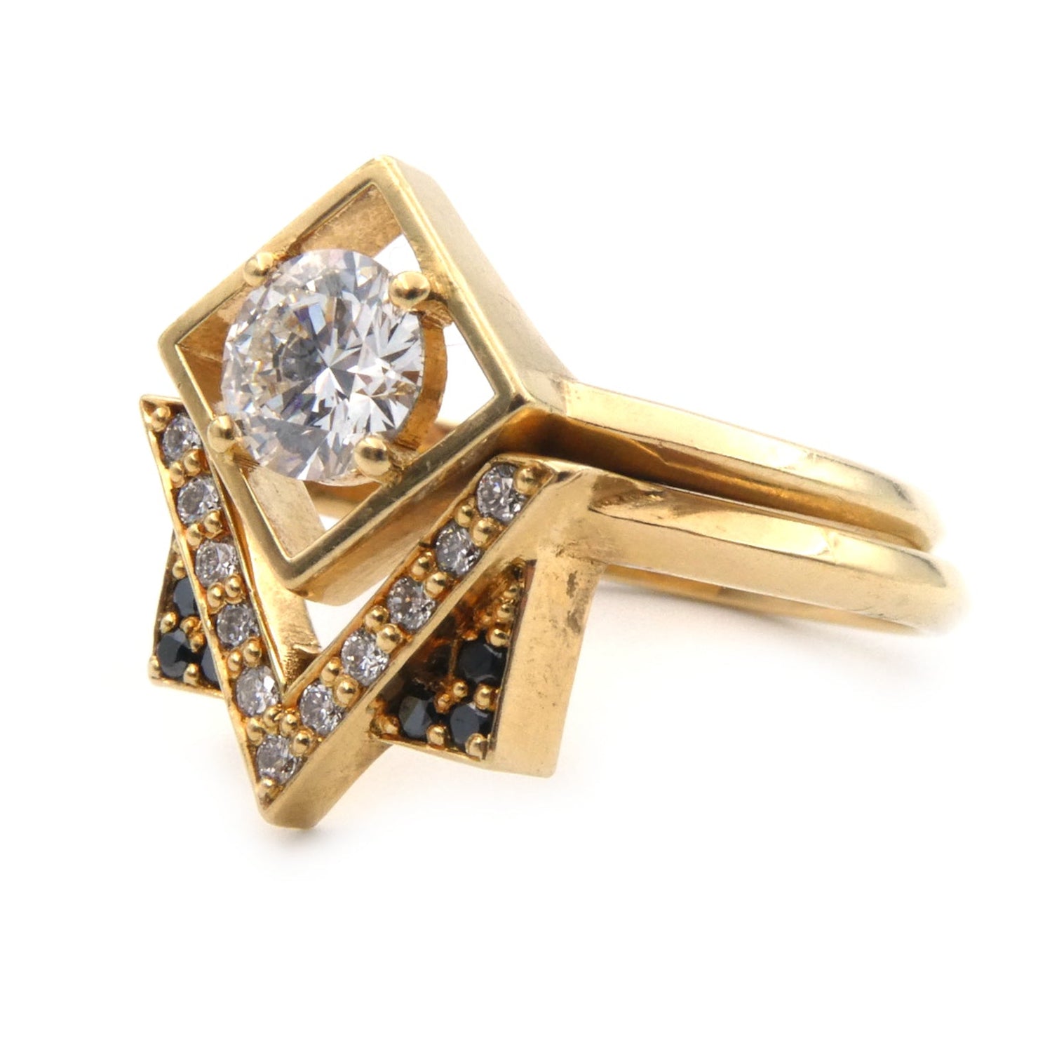 A modern black and white diamond set ring