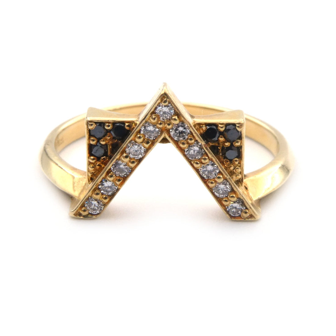 A modern black and white diamond set ring