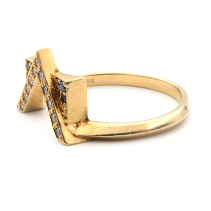 A modern black and white diamond set ring