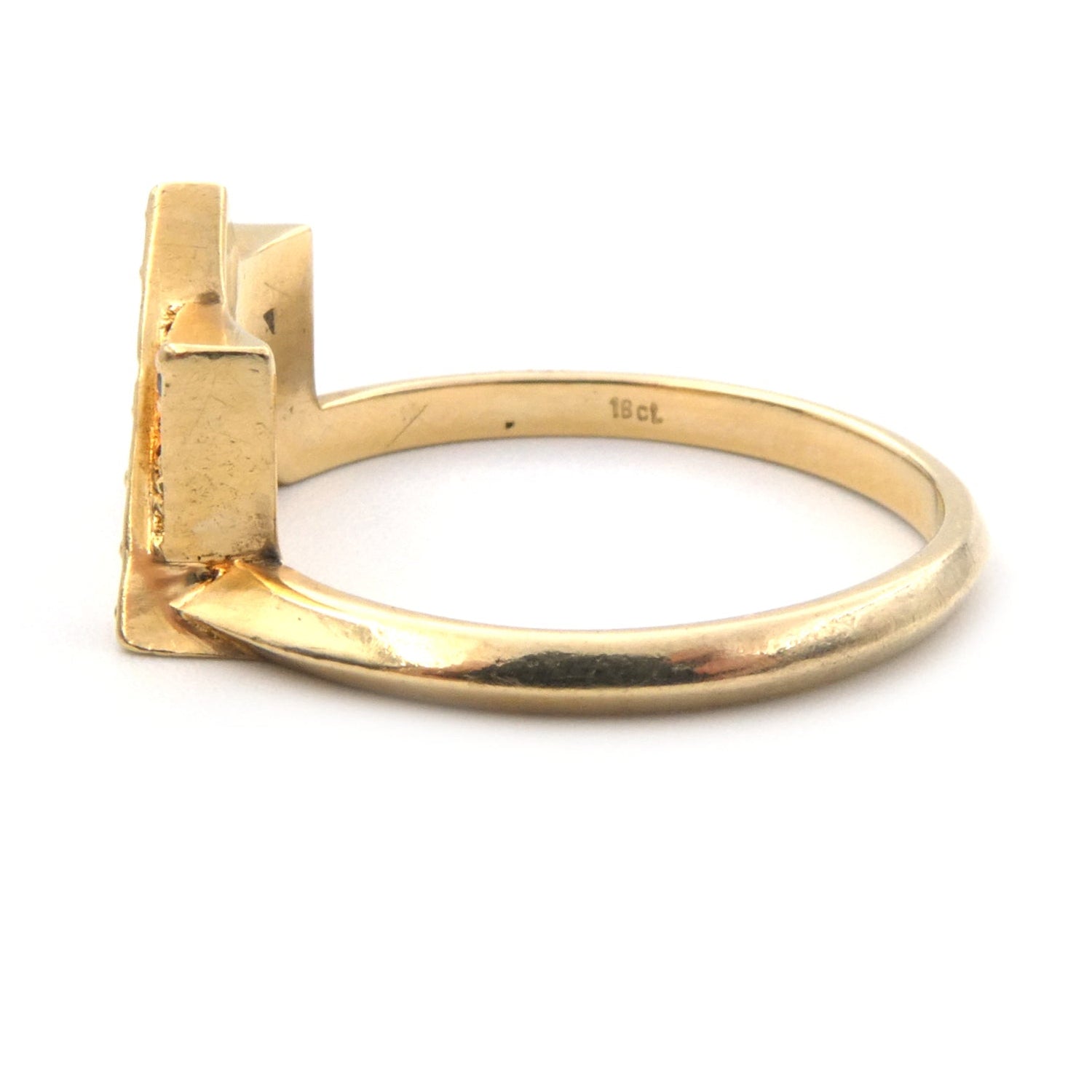 A modern black and white diamond set ring