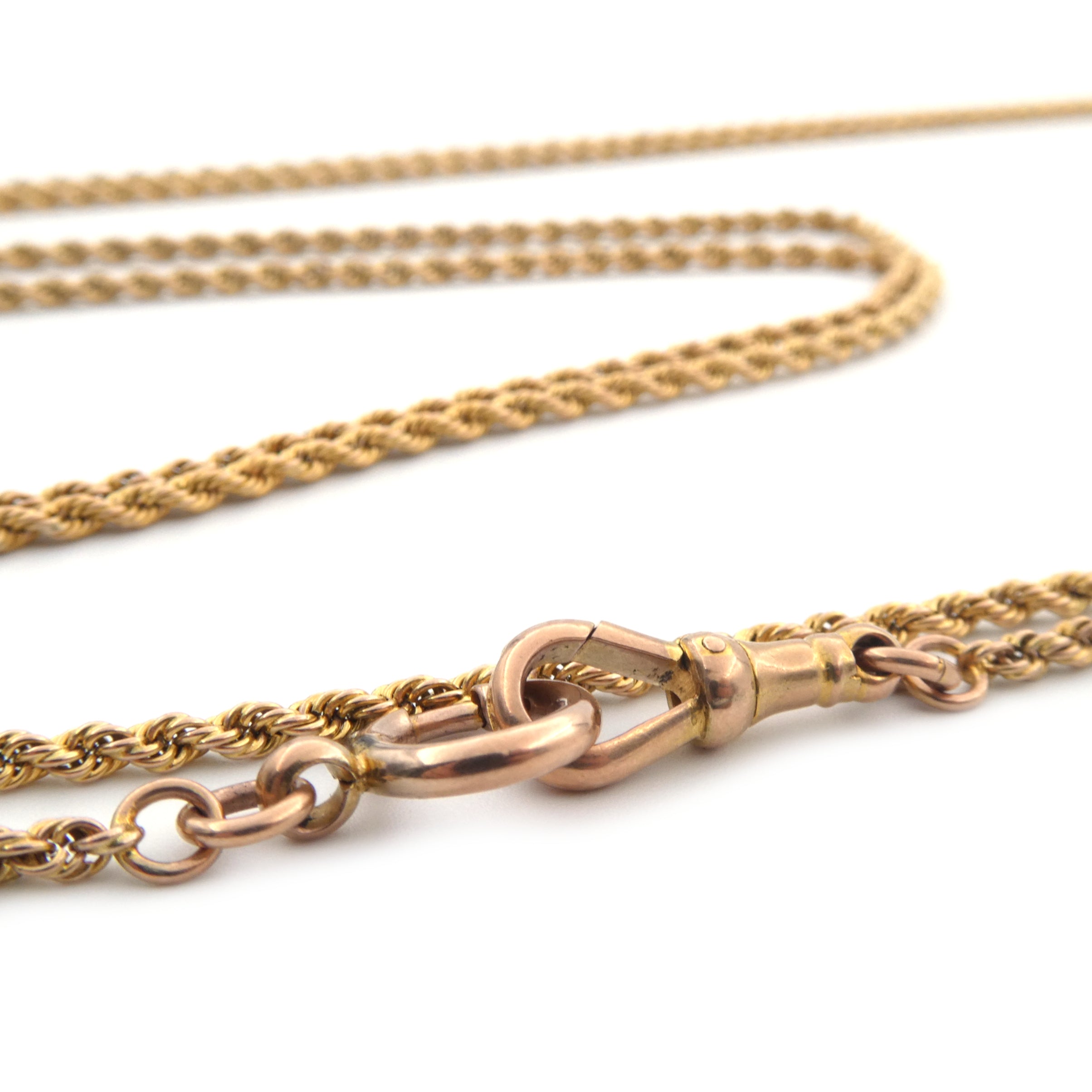 An antique yellow gold muff chain