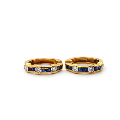 A pair of blue sapphire and diamond hoop earrings