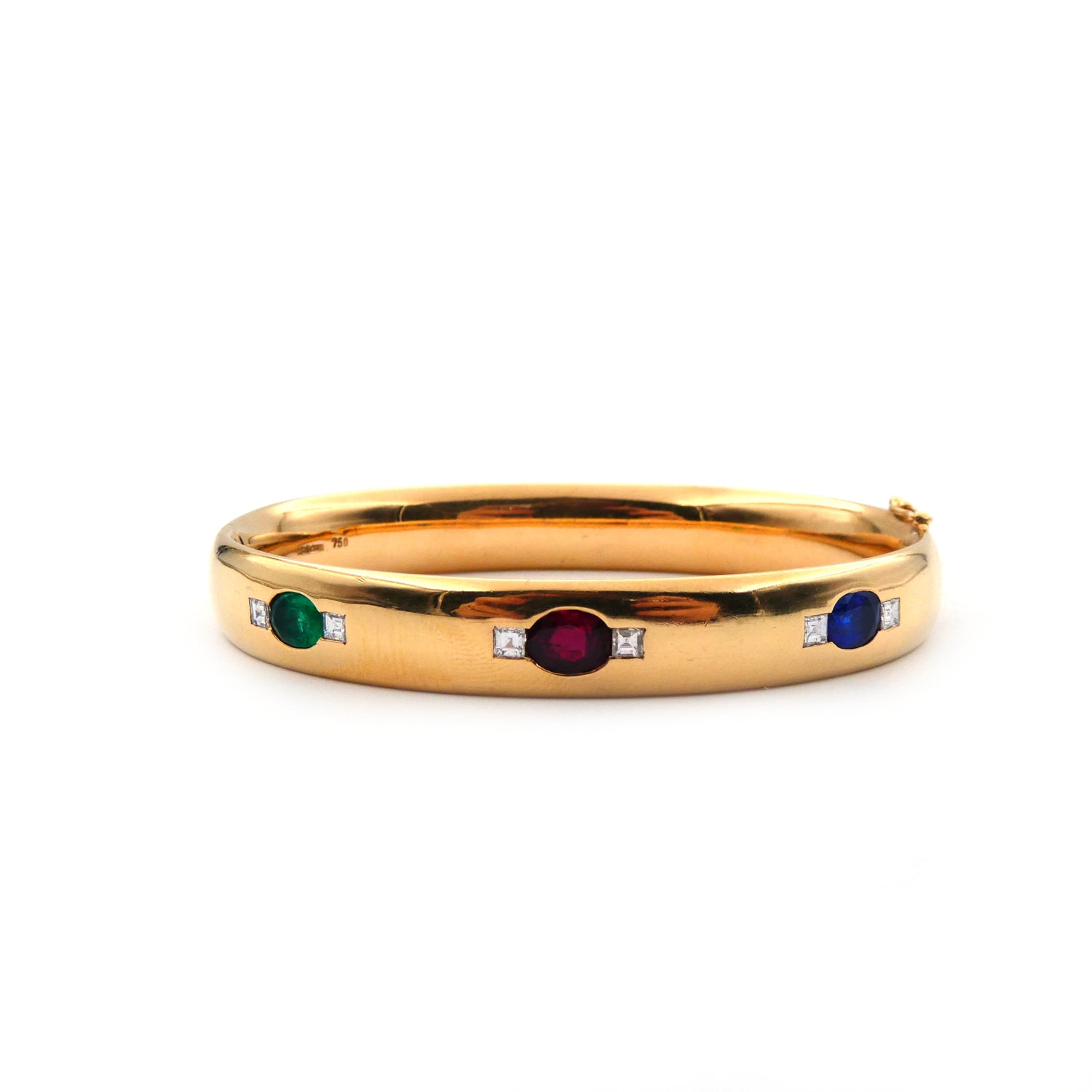 A ruby, sapphire, emerald and diamond hinged bangle