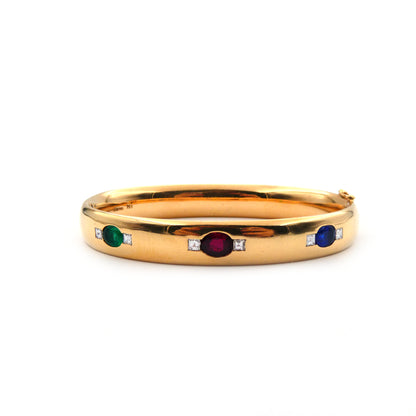 A ruby, sapphire, emerald and diamond hinged bangle